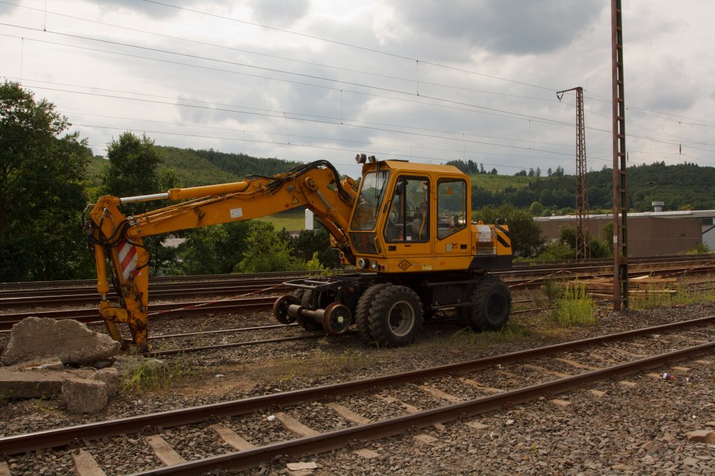 O&K Two road rail excavator (MH-S ZW ) from the company Khnke Gerte und Bau GmbH, on 18.07.2011 in Siegen (Kaan-Marienborn). Small car no. 97 51 69 556 60-5
