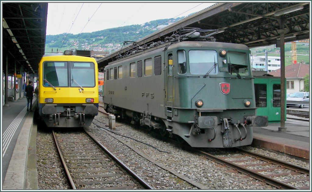 On the right from the  Train des Vignes  waits the SBB Ae 6/6 11514 to the departure. 
18. 06.2010