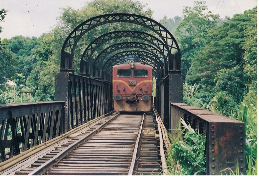 
Original Class M5 Hitachi locomotives became  unsuccessful and subsequently some of them rehabilitated with Paxmon & Caterpillar engines. The one in the picture is  772 crossing Mahawali river near Peradeniya Junction in 2012 April.    

