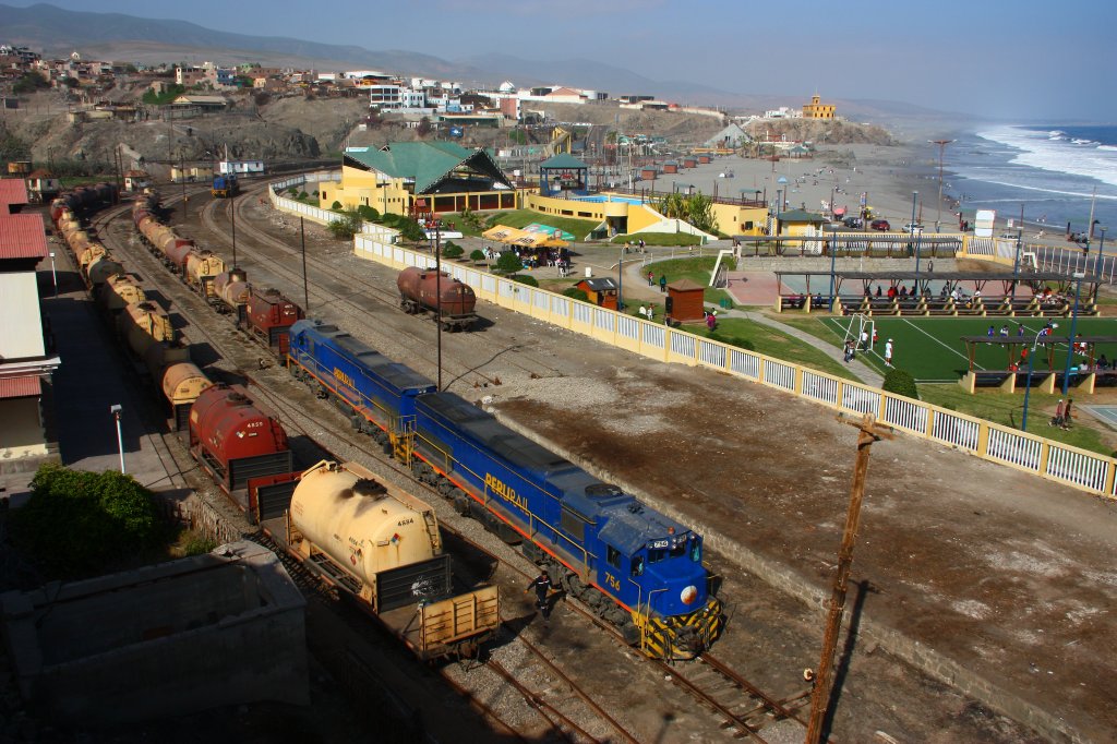 Perurail 756 & 752 have arrived to Mollendo with their train of empty tank cars. These cars are going to be filled at the loadout just left of the yellow castle