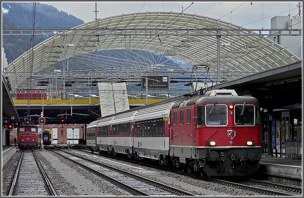 Re 4/4 II 11116 is waiting for the departure to St Gallen at the station od Chur on December 25th, 2009.