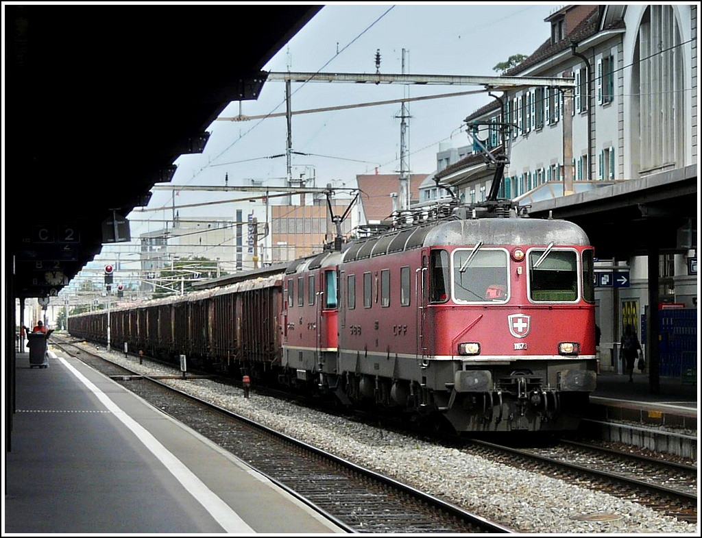 Re 4/4 II double header is hauling a freight train through the station of Thun on August 4th, 2008.