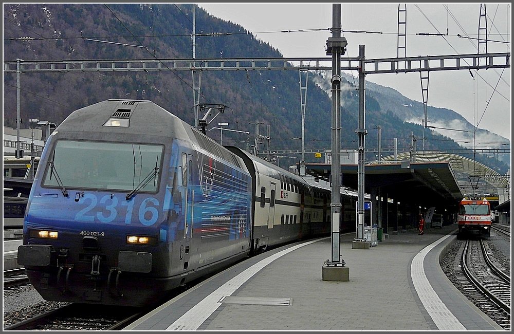 Re 460 021-9 is leaving the station of Chur on December 23rd, 2009.