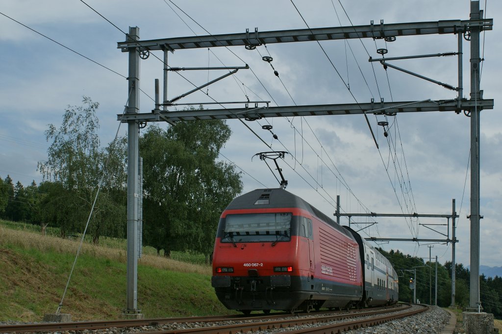 Re 460 067-2 with his IR on the way from Luzern to Geneva by Oron. 