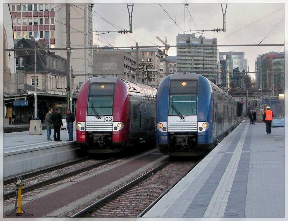 Red and blue trains pictured in Luxembourg City on December 11th, 2007.