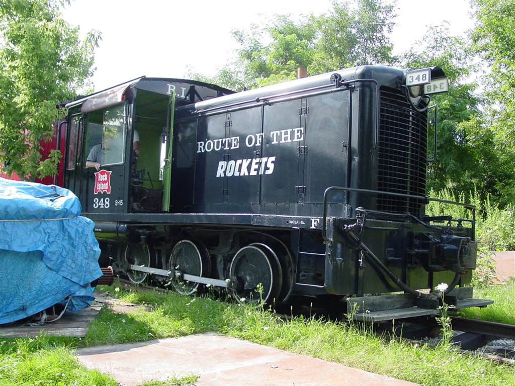 Restored Rock Island 0-6-0 diesel switch engine owned by Larry Raid, Denmark, Iowa. He owns this lok, a CB&Q caboose and rail he laid by himself. 7 July 2004.