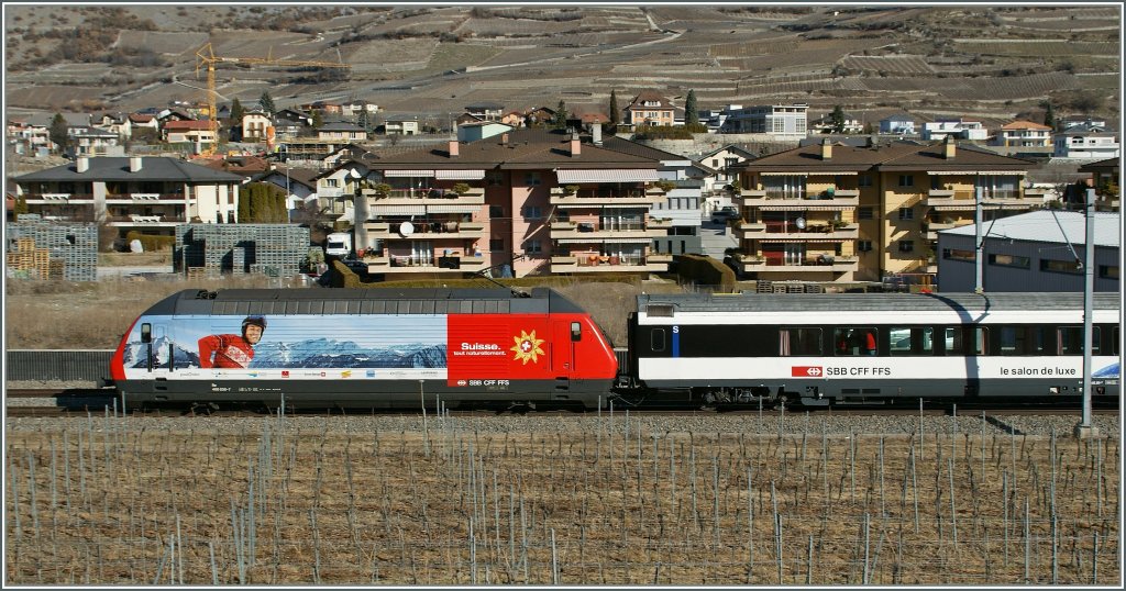 SBB RE 460 036-7 with the  snowtrain  for british winter-guests by Salgesch. 
05.03.2011