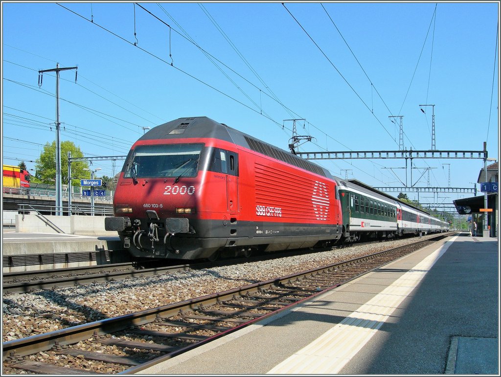 SBB Re 460 103-5 with an IR to Geneva Airport by the stop in Morges. 
19.04.2011