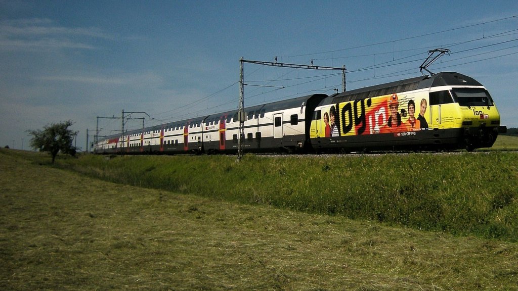 SBB Re 460  Log in  wiht an IC to Geneva Airport  between Fribourg and Romont. 
19.06.2008