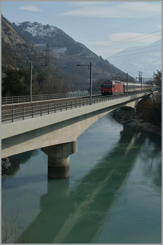 SBB Re 460 with an IR on the Rhone Bridge. 
06.02.2012