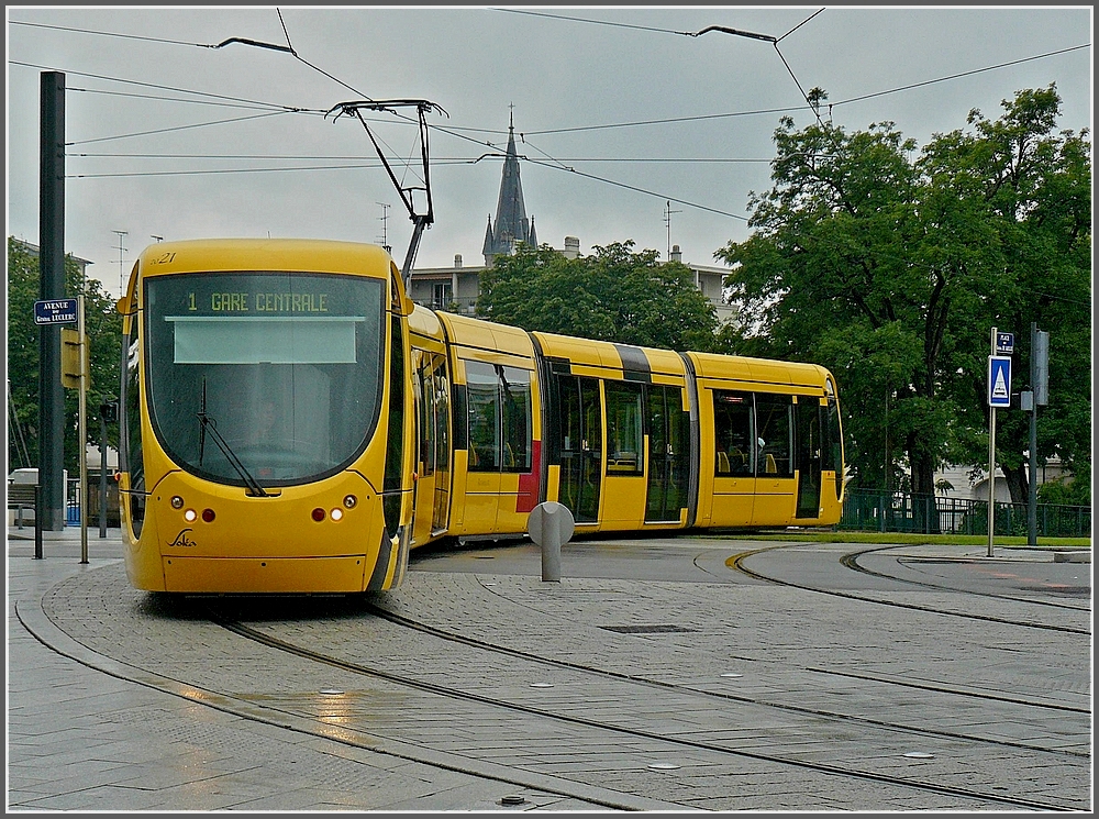 Sola Alstom Citadis 300 N 2027 is arriving at the main station of Mulhouse on June 19th, 2010.