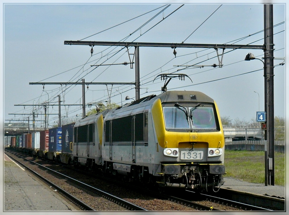 Srie 13 double header is hauling a goods train through the station Antwerpen Noorderdokken on April 24th, 2010.