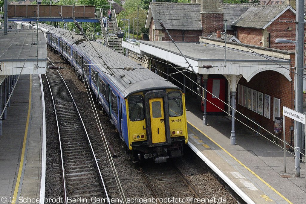 Stansted Mountfitchet, National Express EMU 317654 with the delayed 12,48 Service to Cambridge. 06.05.2011