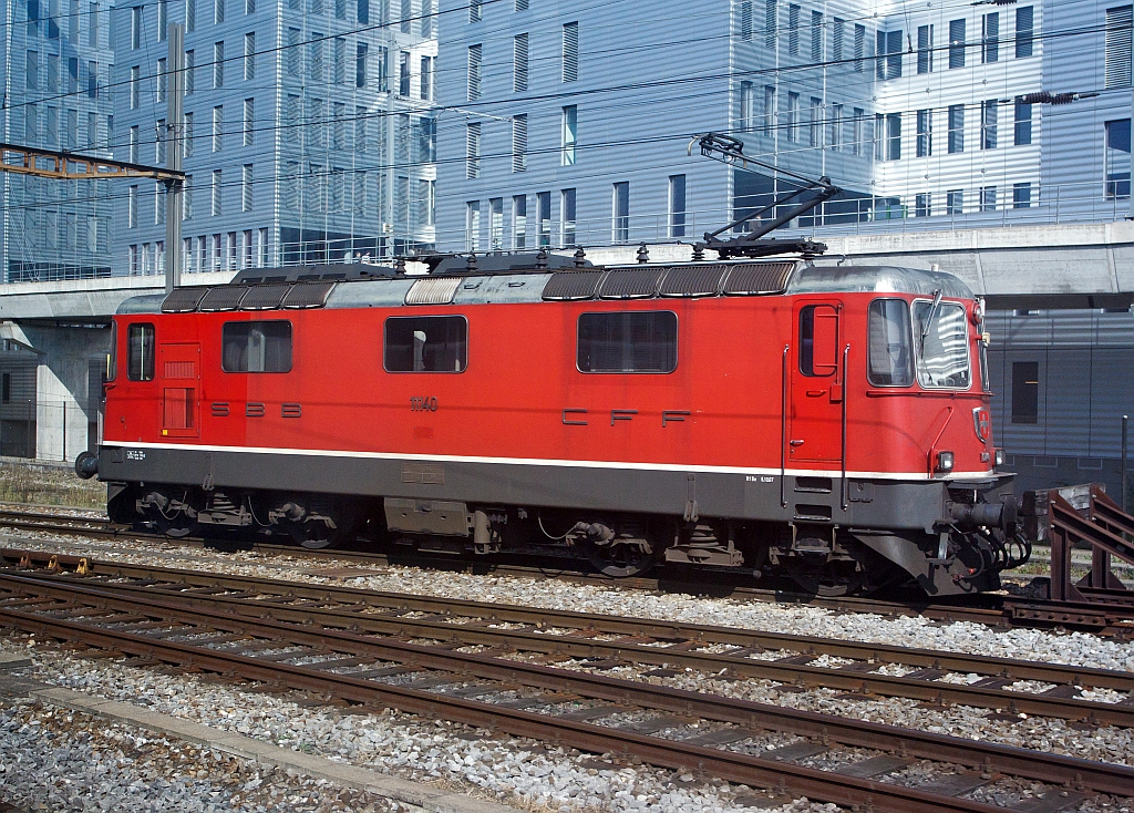 Swiss electric locomotives Re 4/4, No. 11140 of the SBB parked on 30.09.2011 at the station Basel SSB. Photographed out of a moving ICE.