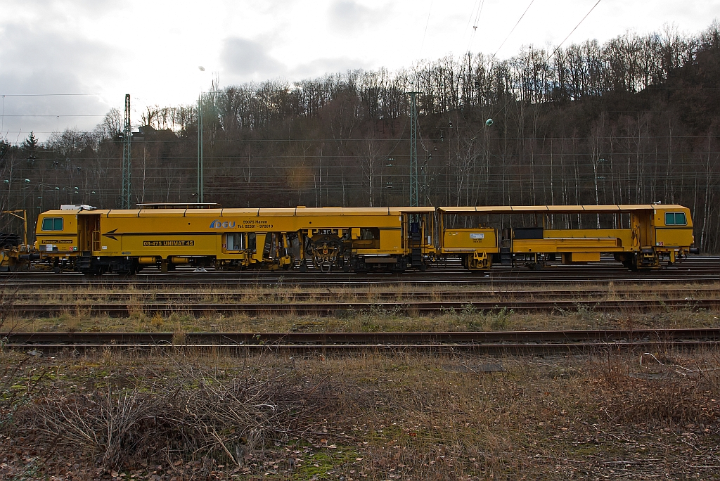 Tamping Machine Plasser & Theurer 08 - 475 Unimat 4S of the DGU (Deutsche Gleisbau Union), parked on 10.12.2011 in Betzdorf/Sieg.