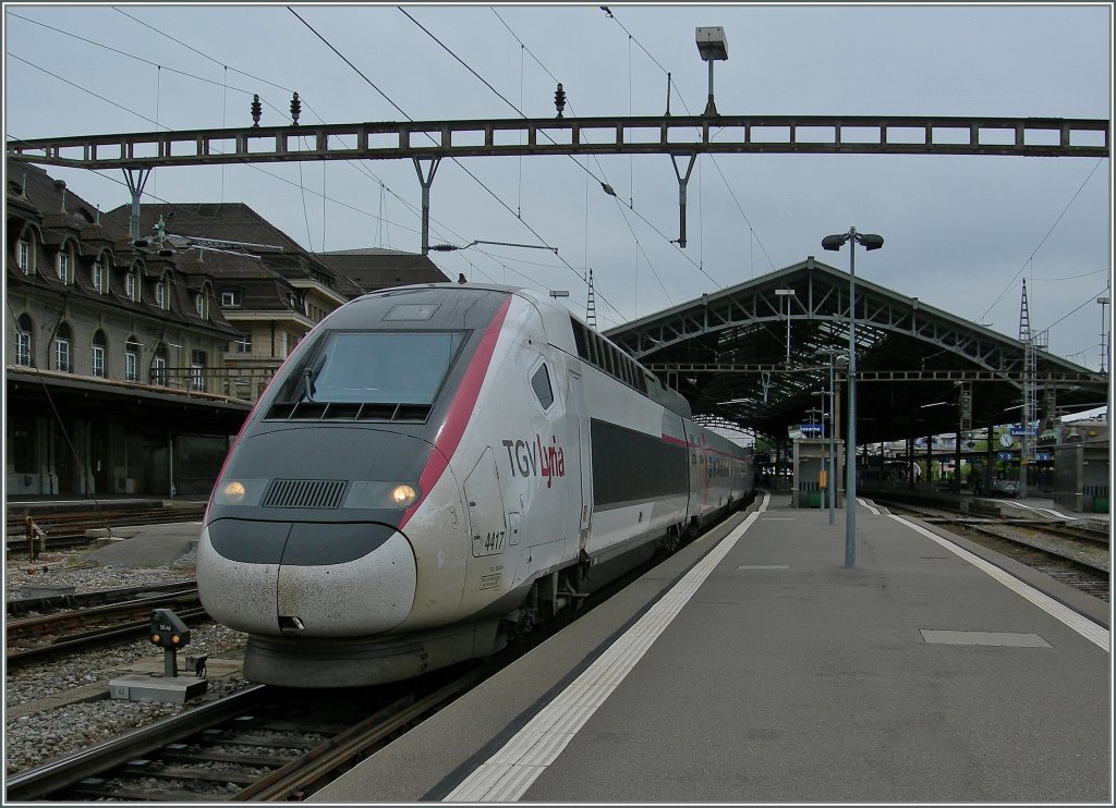 TGV Lyria 4417 to Paris is leaving Lauanne. 18.05.2013 - Rail-pictures.com