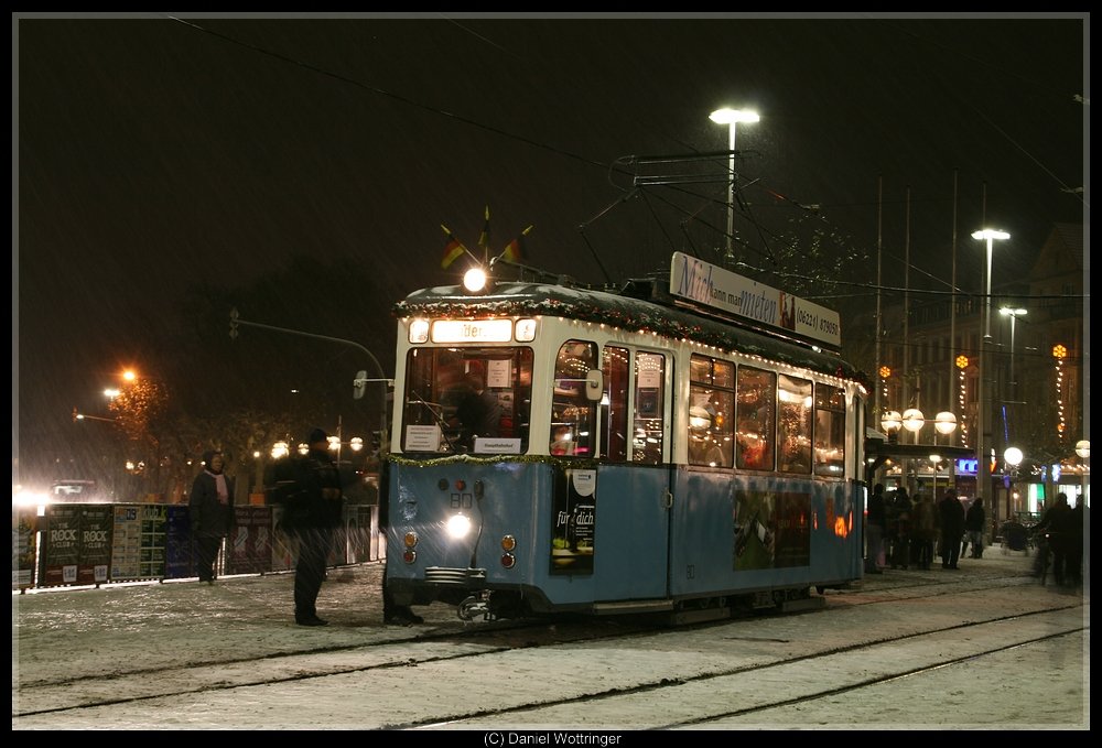 The 2-axle tram 80 as adventexpress in Heidelberg, Bismarckplatz. Its was his first run as adventsexpress with snow.  20th december 2009