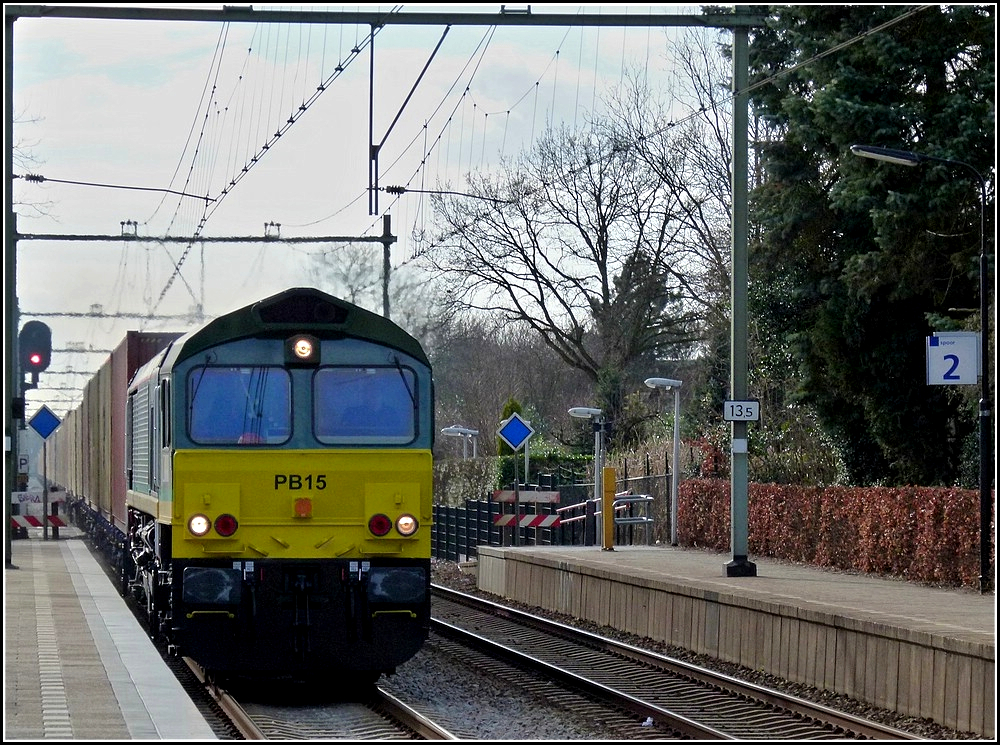 The Ascendos Rail Leasing diesel engine PB 15 is hauling a freight train through the station of Etten-Leur on March 9th, 2011.