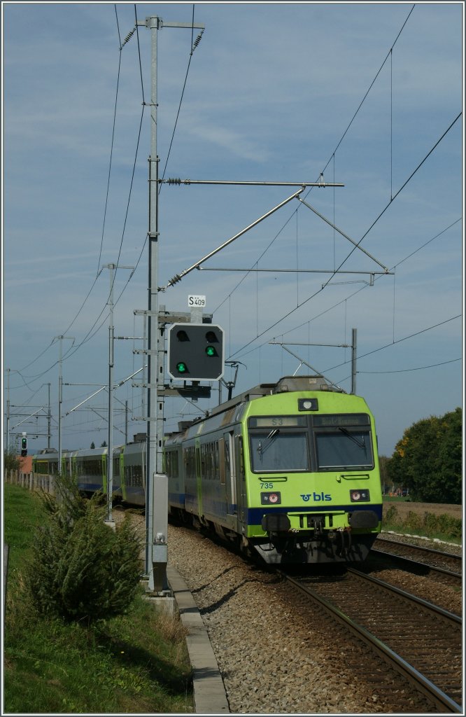 The BLS  S3  to Biel/Bienne is leaving Kehrstatz Nord.
05.10.2012