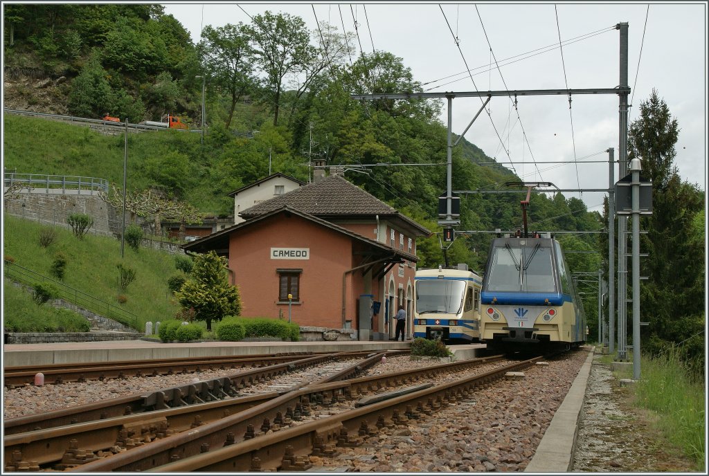 The Border-station Camedo with the Treno Panoramico from Domodossola to Locarno and the local Train to Locarno. 
22.05.2013