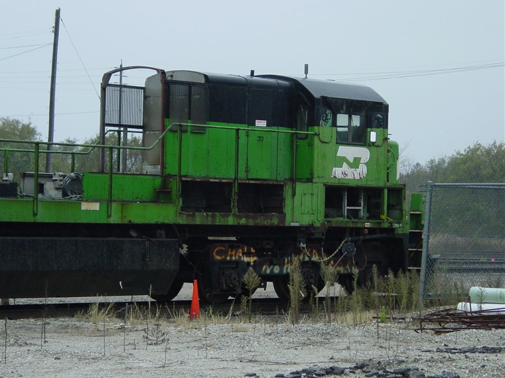 The cab unit of a 5500 series BN locomotive (C30-7) at the West Burlington, Iowa Shops on new years day. The number board hangs in my garage. My friend who used to work here dug it out of a trash dumpster.