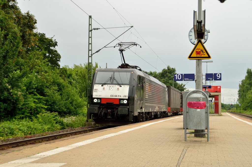 The class MRCE 189 - 281 is riding throug the station of Hochneukirch with an Jan de Rijk containertrain on it's way in the netherlands. 22nd of june 2013