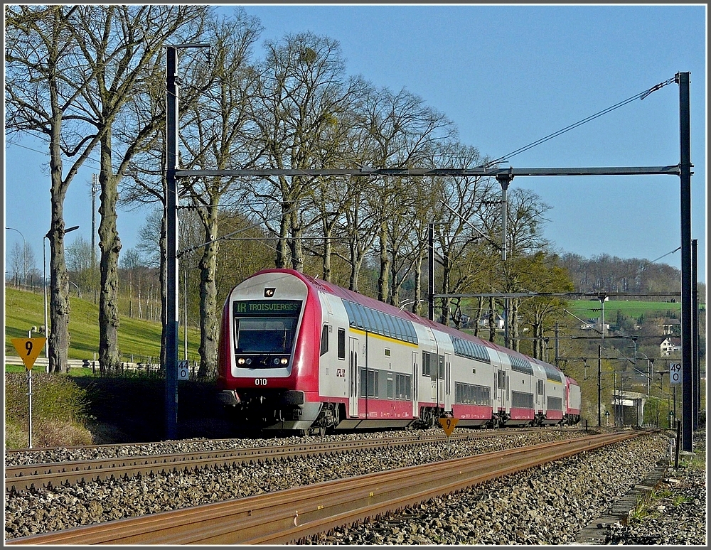 The control car 010 is heading the IR to Troisvierges between Colmar-Berg and Schieren on April 17th, 2010.