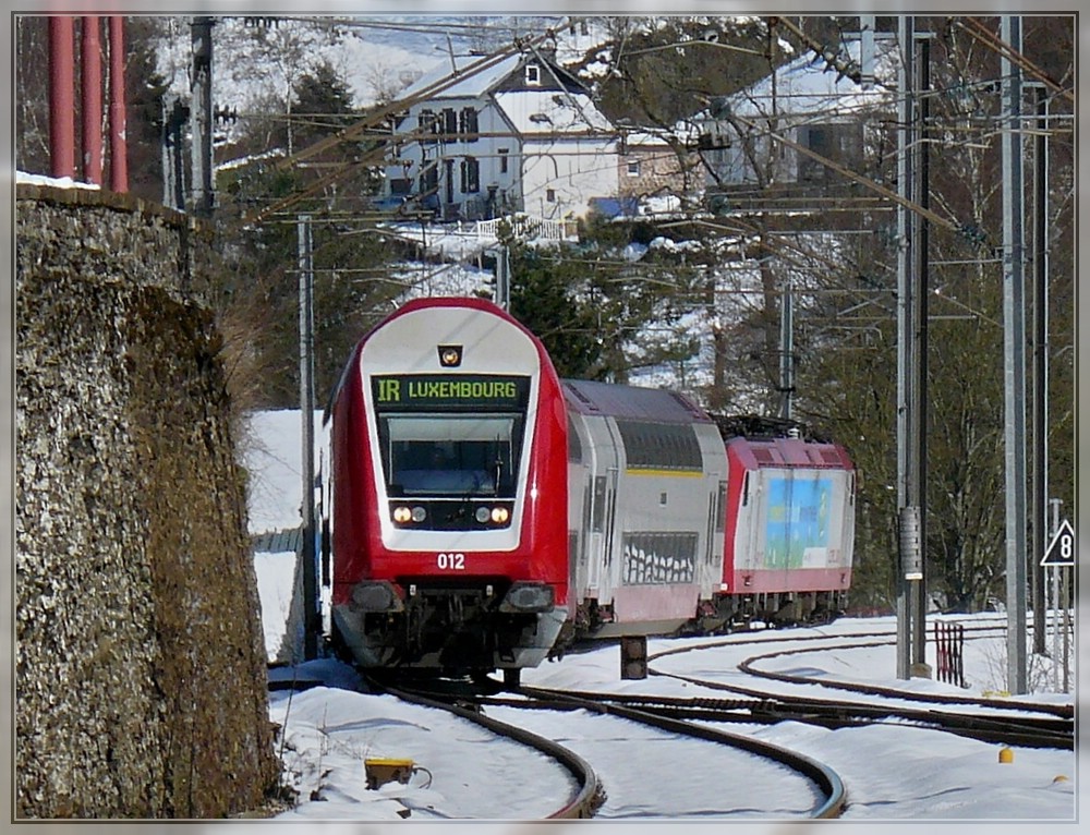 The control car 012 is heading the IR 3714 Luxembourg City - Troisvierges just before arriving in Troisvierges on March 23rd, 2008.