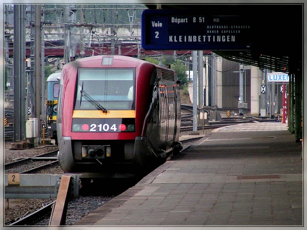 The diesel multiple unit 2104 is leaving the station of Luxembourg City on September 9th, 2004.