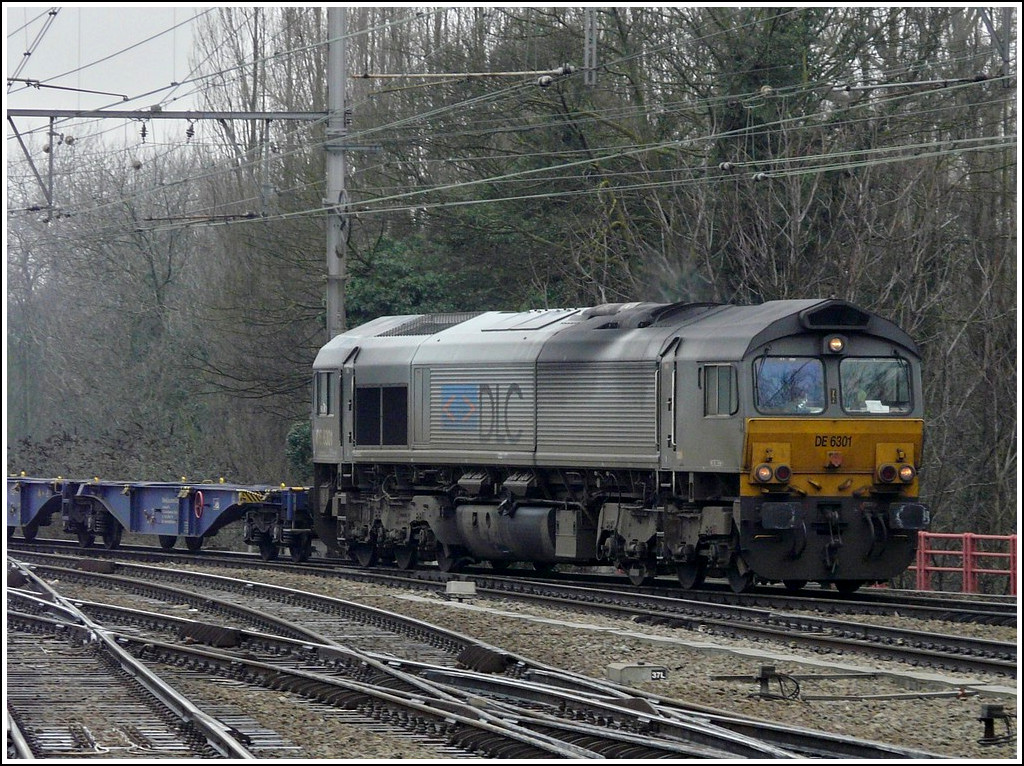 The DLC Railways DE 6301 is hauling a freight train through the station of Brugge on February 27th, 2009.