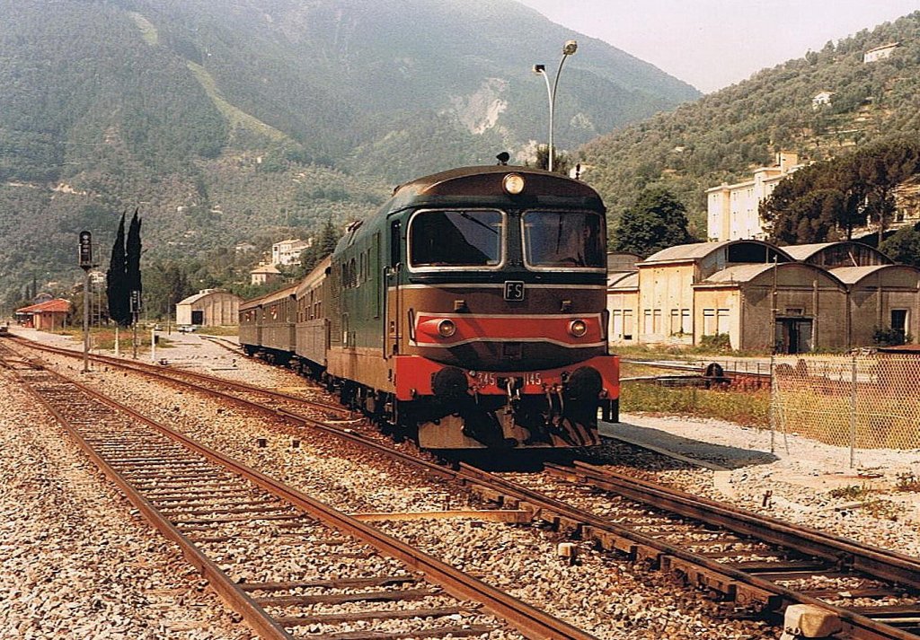 The FS 345 1145 with a local train service to Cuneo is leaving the Brail sur Royal Station. 
June 1985
(scanned analog photo)