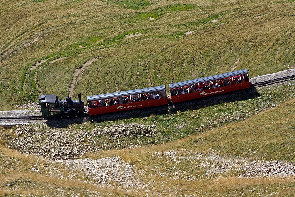 The heating oil-fired locomotive travels BRB 15 on 01.10.2011 up to the Brienzer Rothorn, here just before the Schnegg gallery.