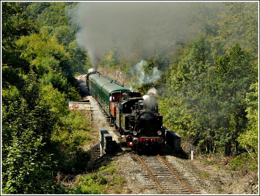 The heritage train is running through the beautiful landscape of the  Ligne du Bocq  in Dorinne-Durnal on August 14th, 2010.