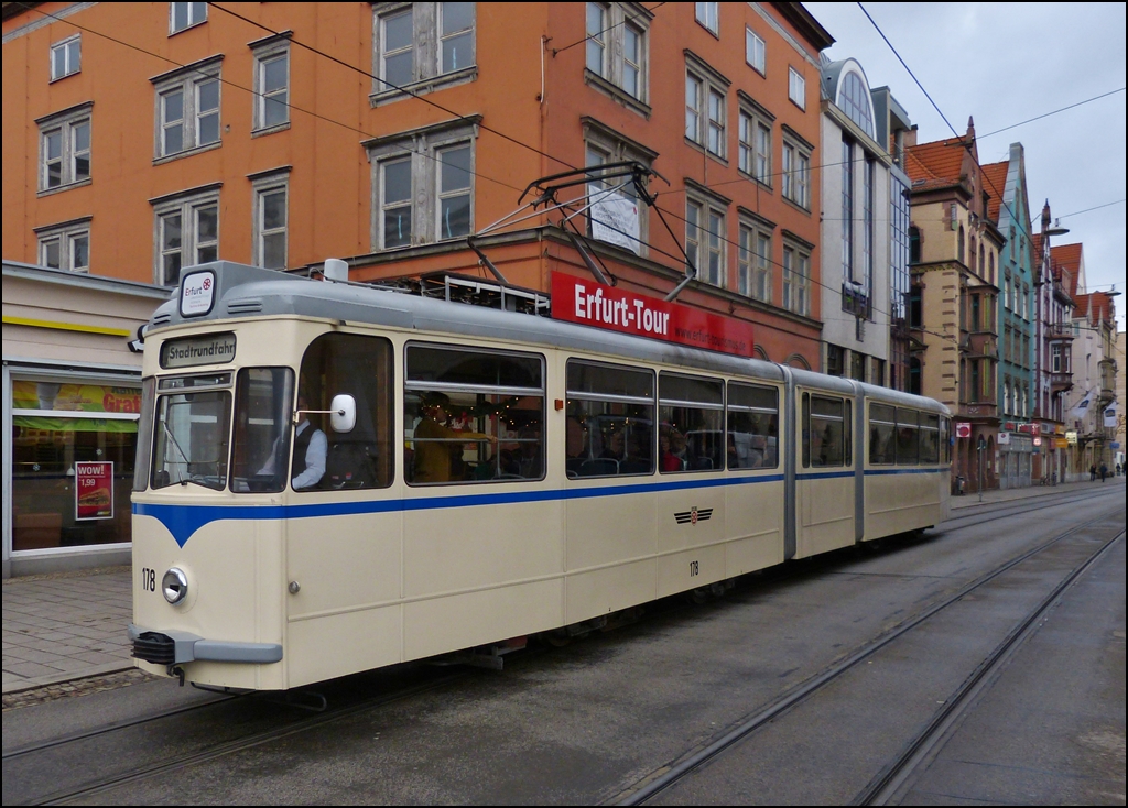 The heritage tram N 178 is running on a sightseeing tour through Bahnhofstrae in Erfurt on December 26th, 2012.