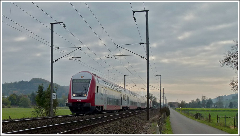 The IR 3712 Luxembourg City - Troisvierges is running through the Alzette valley near Lintgen on October 24th, 2011.