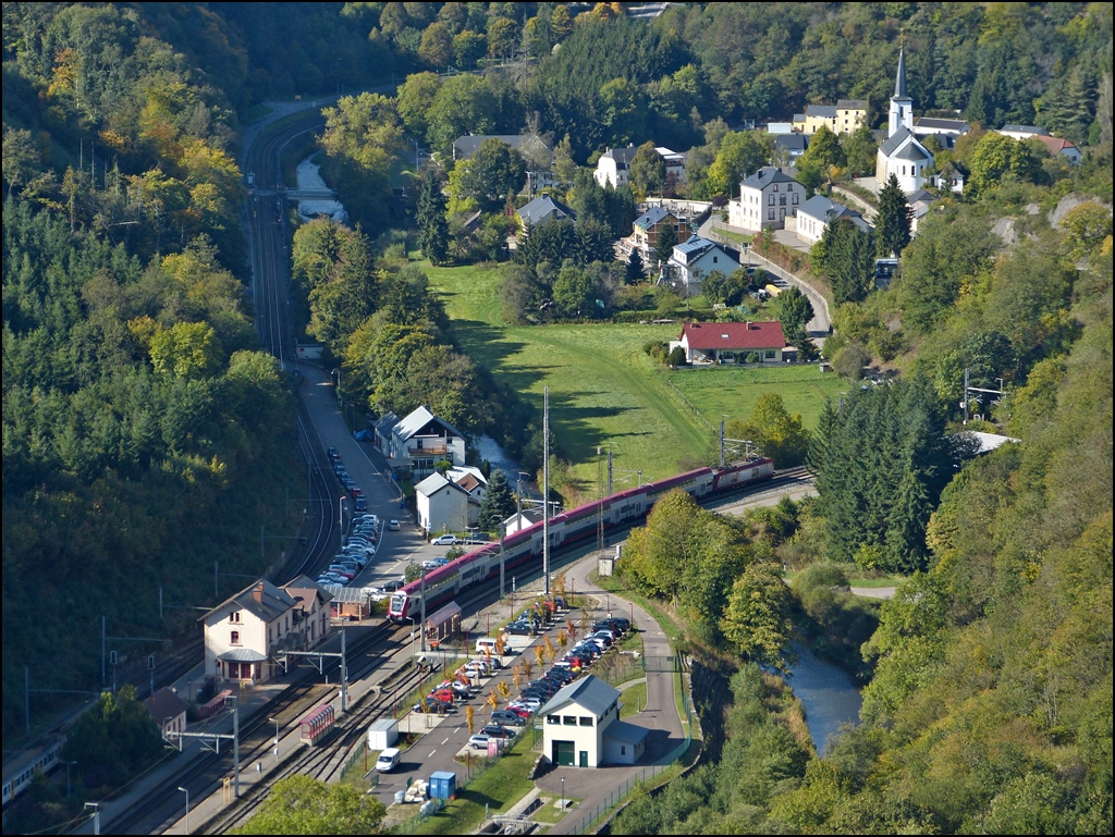The IR 3714 Luxembourg City - Troisvierges is leaving the station of Kautenbach on October 1st, 2012.