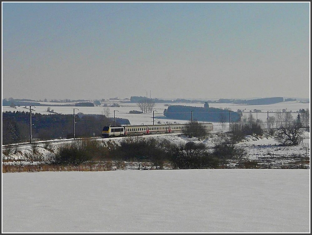 The IR Luxembourg City - Liers is running through the snowy landscape near Basbellain on February 16th, 2010.