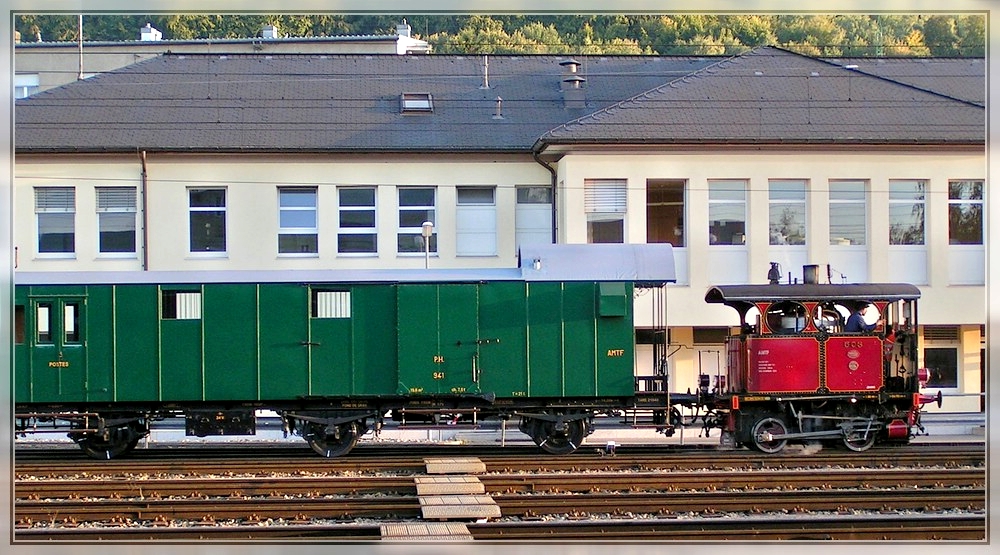 The little steam engine 503 is hauling a big wagon through the station of Ptange on September 19th, 2004.