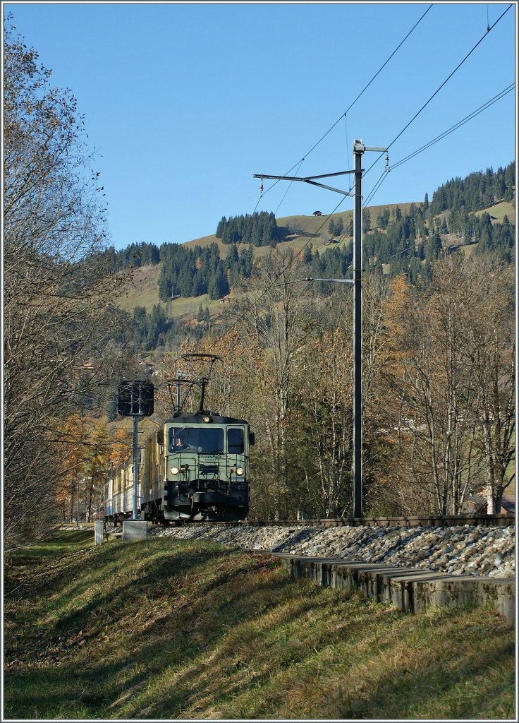 The MOB  Chocolate  GDe 4/4 with a local train by Saanen. 
05.11.2010