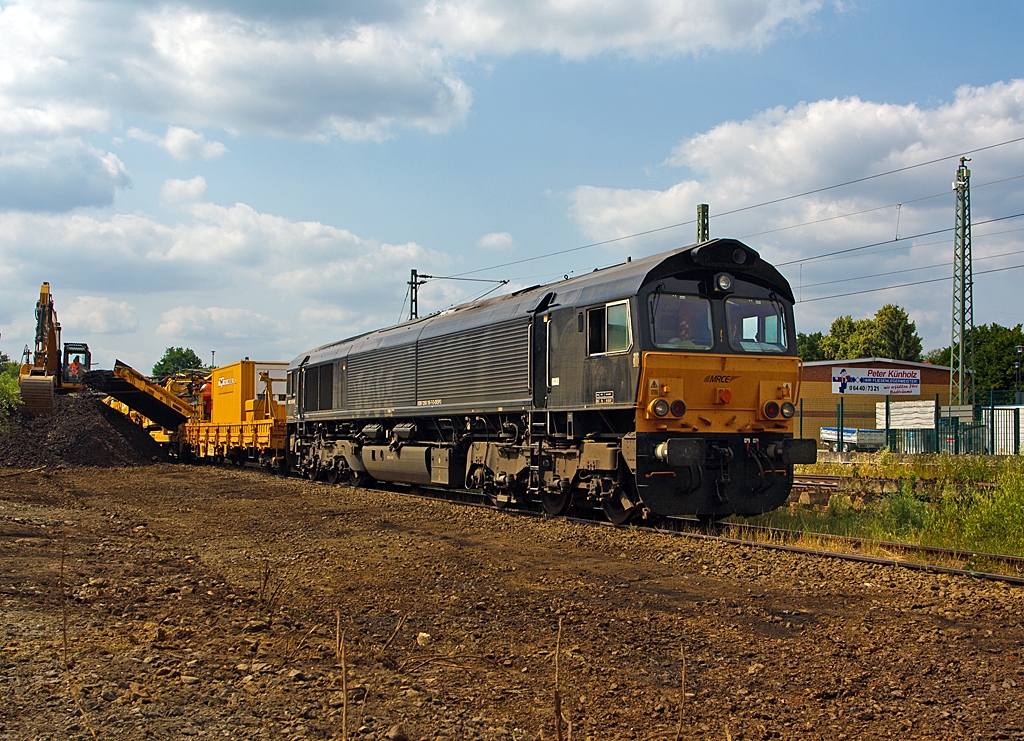 The MRCE 653-09 (92 80 1266 119-7 D-DISPO) an EMD JT42 CWRM (Class 66/9) on 13.07.2013 in Ehringshausen (Lahn-Dill-Kreis) at the KBS 445 (Dillstecke). Here was the locomotive for unloading wagons with old ballast.

The General Motors  JT42 CWR-M “Class 66” is a heavy haul, 6-axle, diesel-electric locomotive.
The locomotive has a two stroke 2.420 kW / 3.290 HP, Turbo charged 12N-710G3B-T2 diesel engine. This DC powered
locomotive is controlled by an onboard computer (EM 2000) and has various feedback and sensing devices.
MRCE offers this locomotive homologated in Belgium, the Netherlands and Germany, including ETCS (L1 &L2) for the Betuwe Line and Rotterdam Harbourline.
The JT42 CWR design originated in the 1970’s, the current production model is the result of many improvements made since that time. It has proven itself to be a solid based model, and with its basic design and DC traction power, is a reliable asset in any fleet.

This locomotive was built in 2005 by EMD at the factory number 20048653-09.

Technical Data:
Wheel arrangement: Bo`Bo`
Track gauge: 1 435 mm
Length over buffers: 21 349 mm
Distance between bogie centers: 14 140 mm
Width: 2 692 mm
Weight: 129,6 t
Rating: 2 238 kW (on the track)
Diesel engine: 12N-710G3B-T2
Speed range: 904 rpm
Maximum speed: 120 km/h
Starting tractive effort: 409 kN
Traction motors: 6 units of D43TR (DC)
