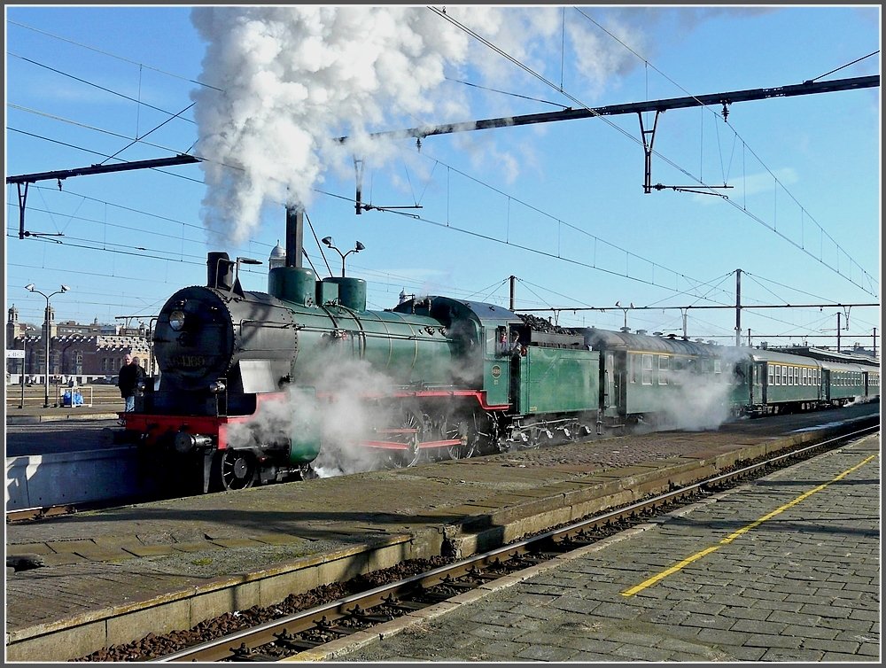The PFT-TSP steam locomotive 64.169 (P 8) is leaving the station Gent Sint Pieters on February 14th, 2009.