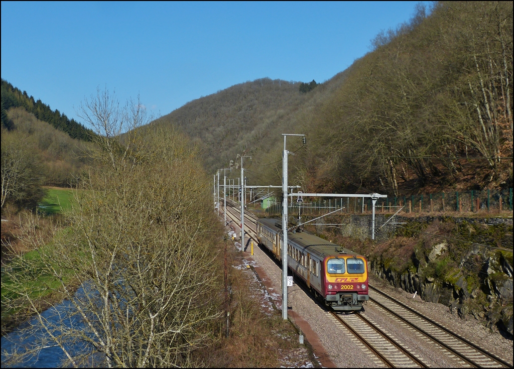 The RB 3237 Wiltz - Luxembourg City is running along the river Wiltz in Goebelsmhle on February 18th, 2013.