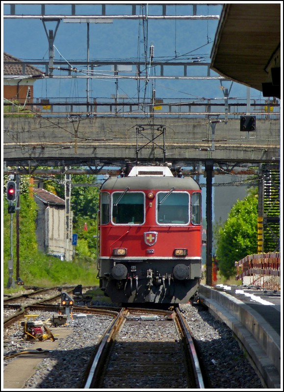 The Re 4/4 II 11122 is entering into the station of Locarno on May 23th, 2012.