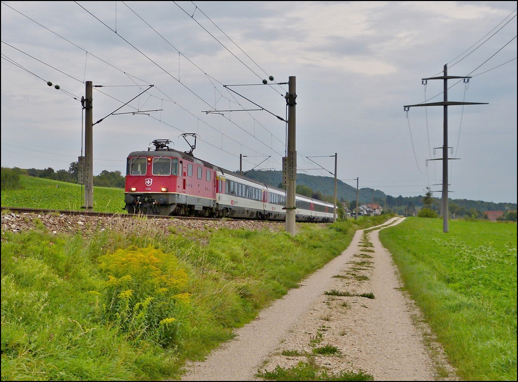 The Re 4/4 II 11222 is hauling the IC Stuttgart - Zrich through Bietingen on September 11th, 2012.