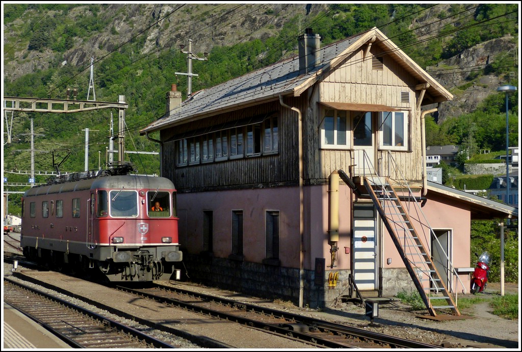 The Re 4/4 II 11608 is running alone through the station of Brig on May 25th, 2012.