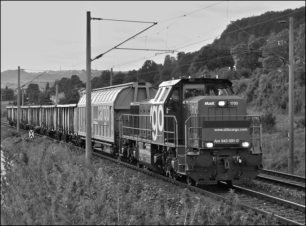 The SBB Cargo Am 843 091-0 is hauling a freight train through Bietingen on September 13th, 2012.