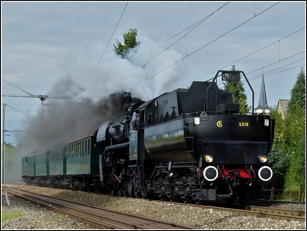 The steam engine 5519 is hauling PH carriages through Schieren on September 19th, 2010.