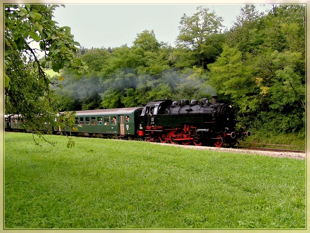 The steam engine 86 33 is hauling the heritage train from Weizen to Zollhaus-Blumberg near Ftzen on August 19th, 2006.