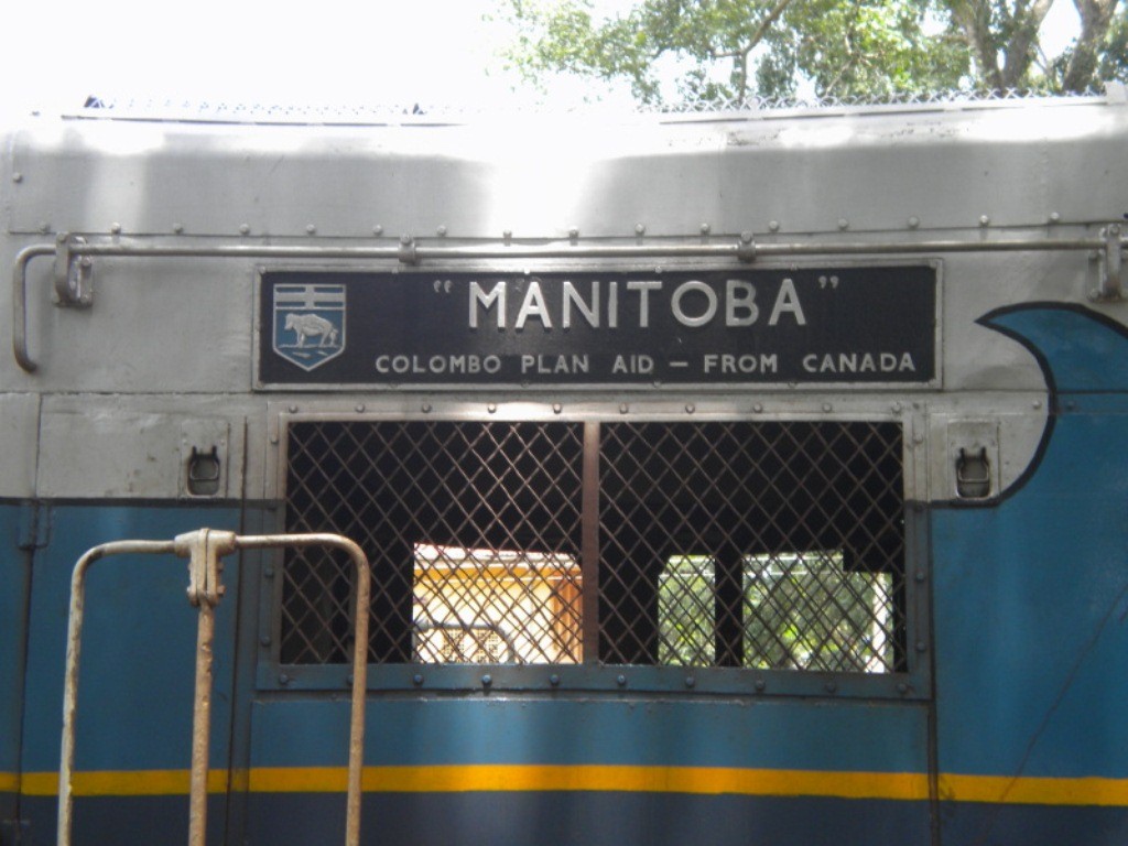 These pictures are in memory of Tsunami 

close up of the name plate of EMD G12 Class M2 591 locomotive named MANITOBA.
The waves on the grey background is visible, this is to indicate it was a Tsunami victim.  