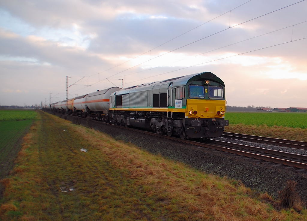 This Class 66 from the Rurtalbahn Company rides down the tracks of the line KBS 495 with it's liquidgastankwagons near Nievenheim. It's companynumber is V 256. The photo is been shot on friday 30th december 2011.